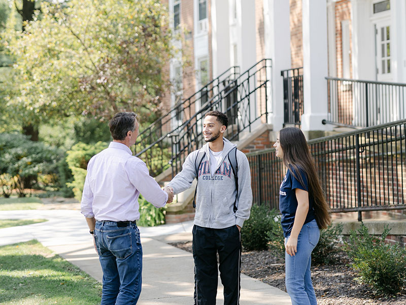 Students talking to a professor at Hiram College